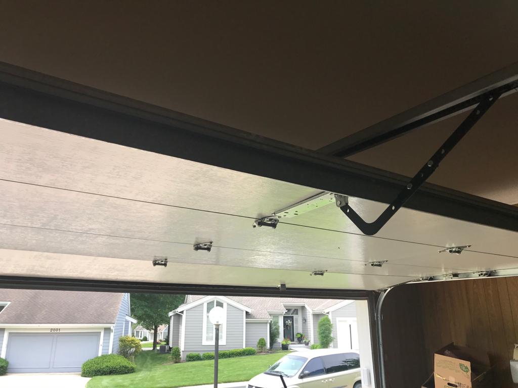 An open garage door on a KC Garage Door Repair job in a Kansas City metro neighborhood